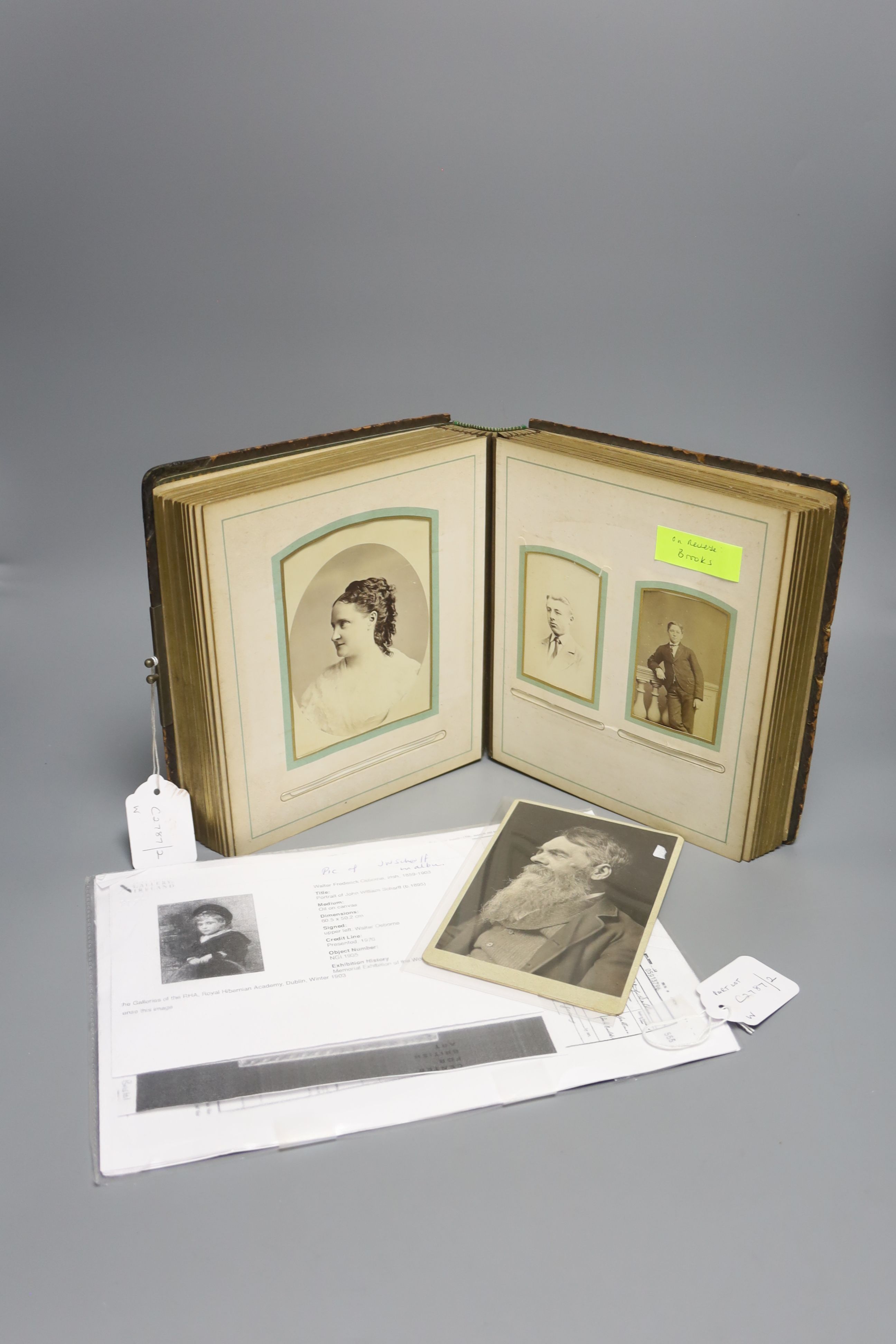 A photographic print of Richard Holt Hutton (1826-1897) by Frederick Hollyer and a Victorian family photograph album